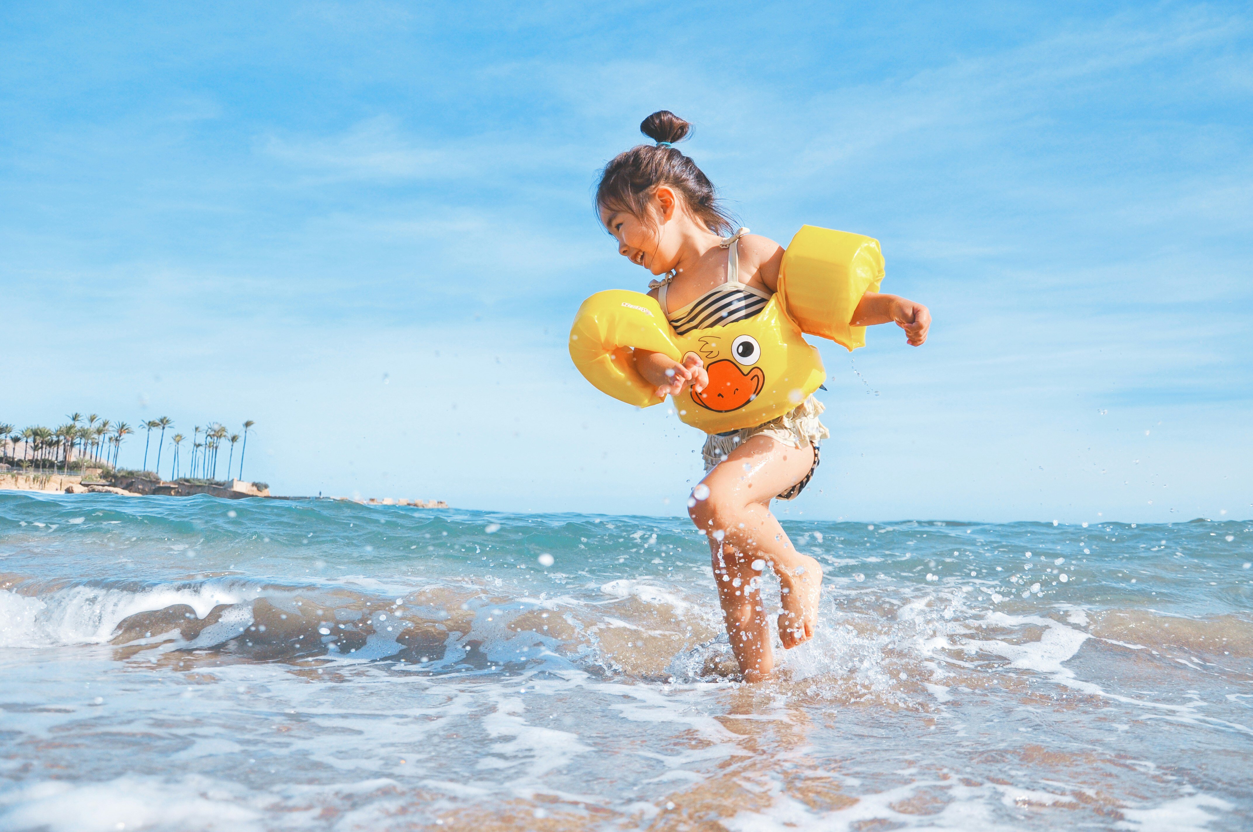 Toddler playing on the beach