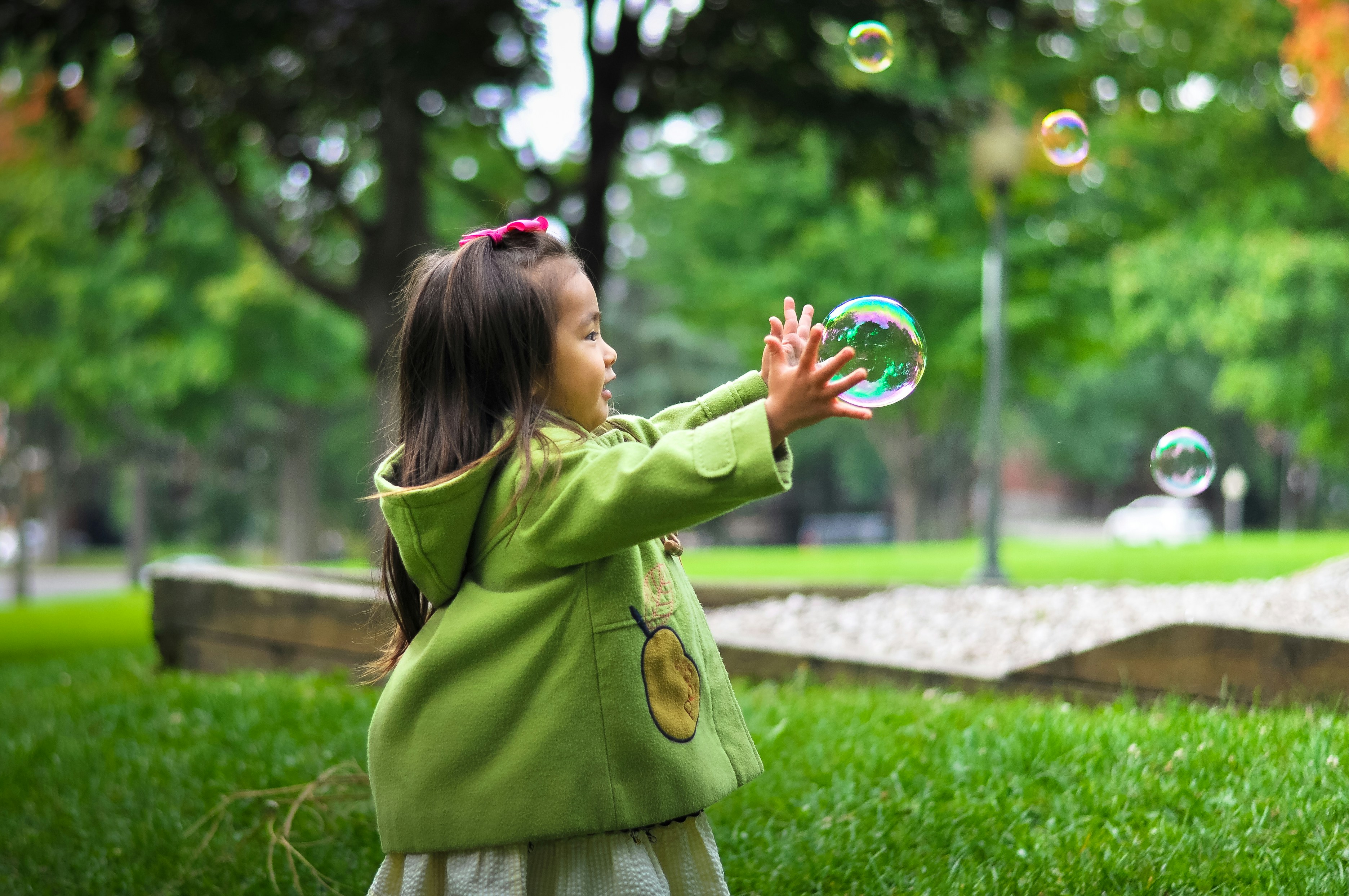 2-years-old playing with bubbles